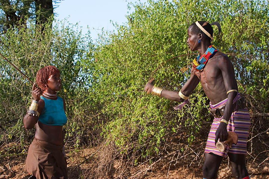 41   Hamar   Whipping of the woman before bull jump ceremony